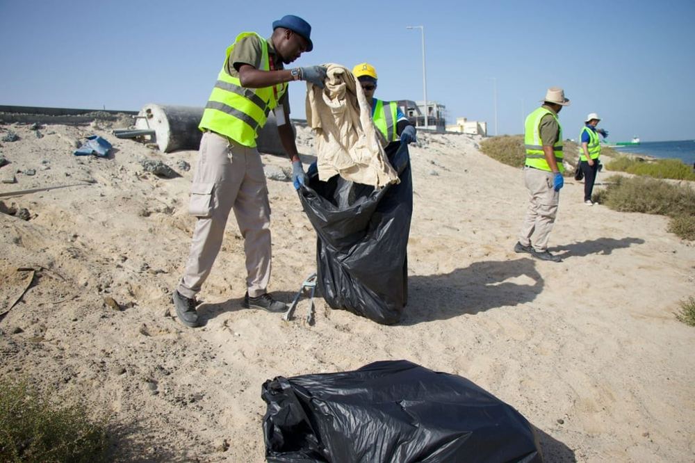 Volunteers on a beach cleaning campaign